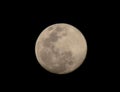 The yellow full moon on black background for your night and dark design concept