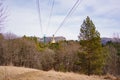 yellow funicular car with passengers moves by cableway.