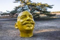 Yellow funny human head sculpture, Birstonas, Lithuania