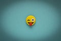 Yellow funny smiley face on blue background. Positive mood concept