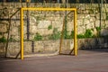 Yellow futsal goal in a school playground, sports concept