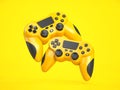 Yellow game joystick or gaming controller on yellow background