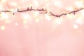 Yellow garland on a pink background. Holiday Christmas concept Royalty Free Stock Photo