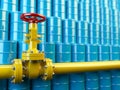 Yellow gas pipe line valves and blue oil barrels. Fuel and energy industrial concept.