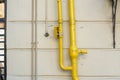 Yellow gas pipe outside the building Royalty Free Stock Photo