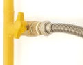 Yellow gas pipe with a valve. White background