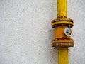 Yellow gas pipes connection on a residentual house wall Royalty Free Stock Photo