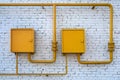 Yellow gas pipes with two closed boxes Royalty Free Stock Photo