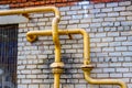 Yellow gas pipes on the wall Royalty Free Stock Photo