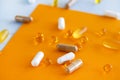 Yellow capsules of nutraceuticals in spoon. Pills and meds. Royalty Free Stock Photo