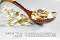 Yellow gelatin capsules with a drug Omega-3, in a wooden spoon, on a white background. Alternative treatment, beneficial body