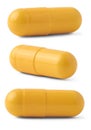 yellow gelatin capsules isolated on white Royalty Free Stock Photo