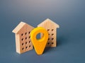 Yellow geo location pin and two houses. Tracking, city navigation internet of things. Location concept, settlement. Search for