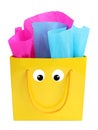 Yellow gift bag with a smiley face on it Royalty Free Stock Photo