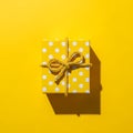 Yellow Gift Box with Polka Dots and Bow Royalty Free Stock Photo