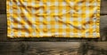 Yellow Gingham Picnic Tablecloth on Rustic Wooden Background Royalty Free Stock Photo