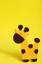 Yellow Giraffe on yellow background