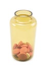 Yellow glass bottle for tablets with pills and drugs  on a white Royalty Free Stock Photo