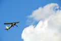 Yellow glider against a blue sky Royalty Free Stock Photo