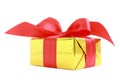 Yellow glossy gift wrapped present with red satin bow