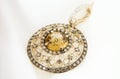Yellow Gold Pendant With Citrine And Diamonds On Soft White Background Royalty Free Stock Photo