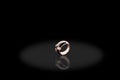 Yellow Gold precious ring female with big diamonds on black background.