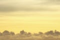 Yellow golden sky with fluffy cloud. Morning sunrise sky. Cloudscape background.