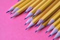 Yellow graphite pencils on a pink background Royalty Free Stock Photo