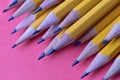 Yellow graphite pencils on a pink background Royalty Free Stock Photo