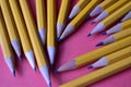 Yellow graphite pencils on a pink background Royalty Free Stock Photo