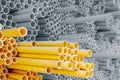 Yellow and gray PVC pipes for electrical conduit