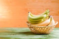 yellow and green bananas on green blackboard board on yellow background Royalty Free Stock Photo