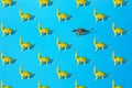 Yellow green Brachiosaurus and gray Ankylosaurus plastic toy dinosaur on a blue background. Pattern Royalty Free Stock Photo