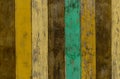 Yellow, green, and brown wooden wall texture background. Old wood floor with cracked color paint. Vintage wood abstract background Royalty Free Stock Photo