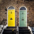 Yellow and green doors of a terrace Georgian house in London UK Royalty Free Stock Photo