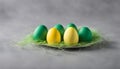 Yellow and green easter egges on a grey background Royalty Free Stock Photo