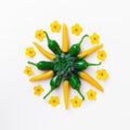 Yellow and green hot peppers with flowers compositions Royalty Free Stock Photo