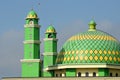 Yellow-green mosque dome and minarets in Boyolali