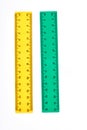 Yellow and green plastic rulers.