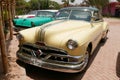 Yellow and green Pontiac Catalina coupe in Lima Royalty Free Stock Photo