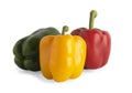 Yellow-green red bell peppers are on the white back Royalty Free Stock Photo