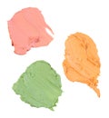 Yellow, green and red concealer swatch isolated over white