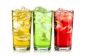 Yellow, green and red drink with ice cubes on white background, isolated