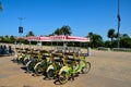 Yellow and green tandem cycles for rent at Black sea front by tourists Batumi Georgia