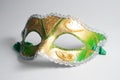 yellow and green Venetian mask on white background Royalty Free Stock Photo