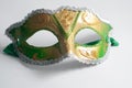 yellow and green Venetian mask on white background Royalty Free Stock Photo