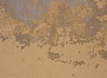 Yellow grey brown old scratched shabby stucco wall with damaged paint Royalty Free Stock Photo