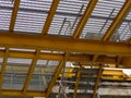 Yellow grid construction floor with stairs going up