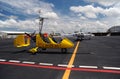 Yellow gyroplane in the international airport