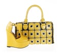 Yellow handbag and wedge shoe isolated on white